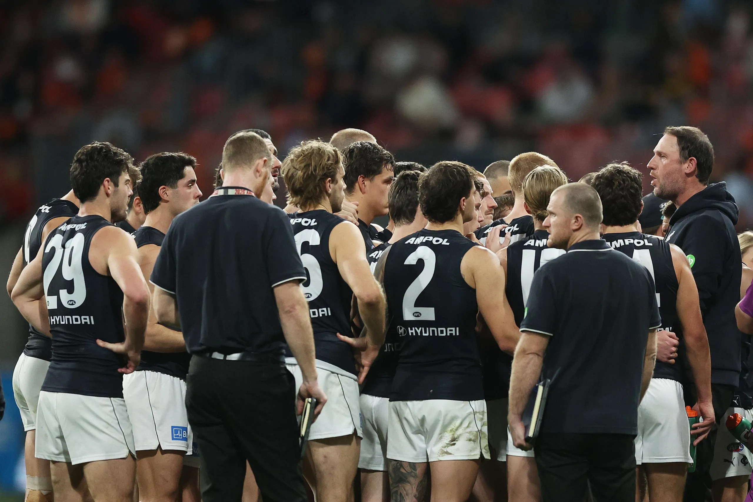 Carlton interim coach Josh Fraser addresses the Blues players during an AFL match against GWS Giants