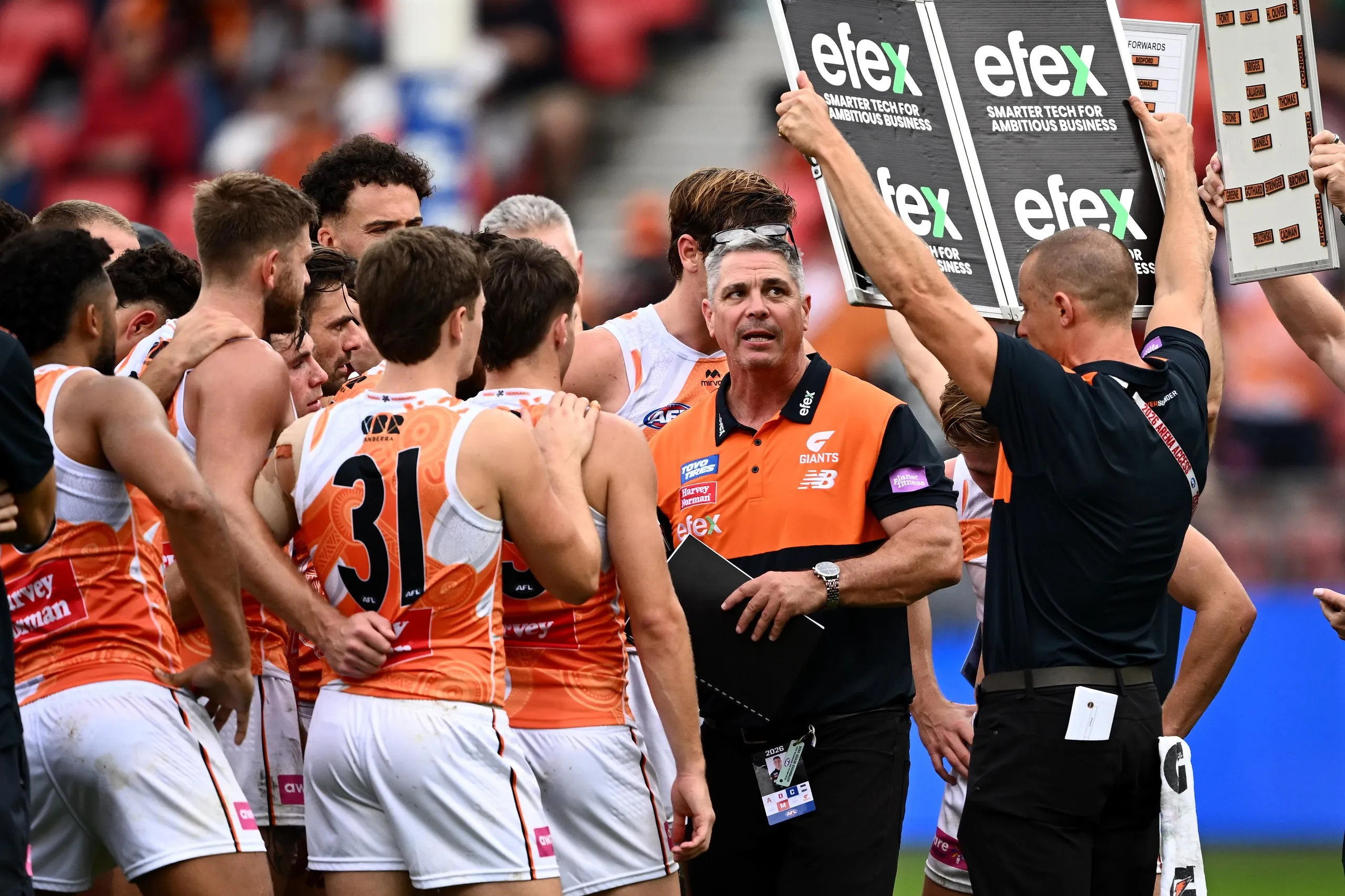 Giants head coach Adam Kingsley addresses his team at three-quarter-time.