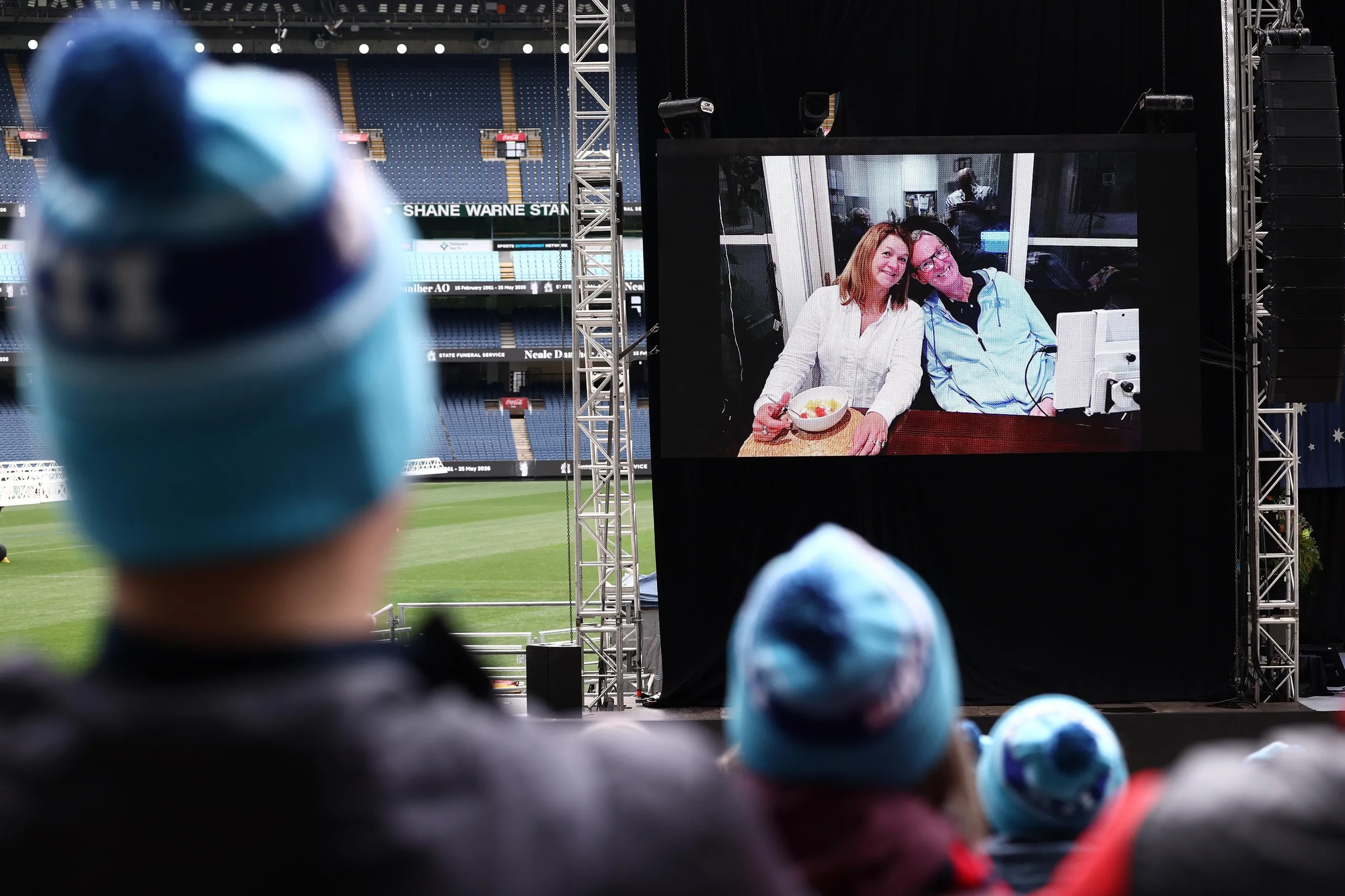A pictorial tribute is shown during the Neale Daniher state funeral