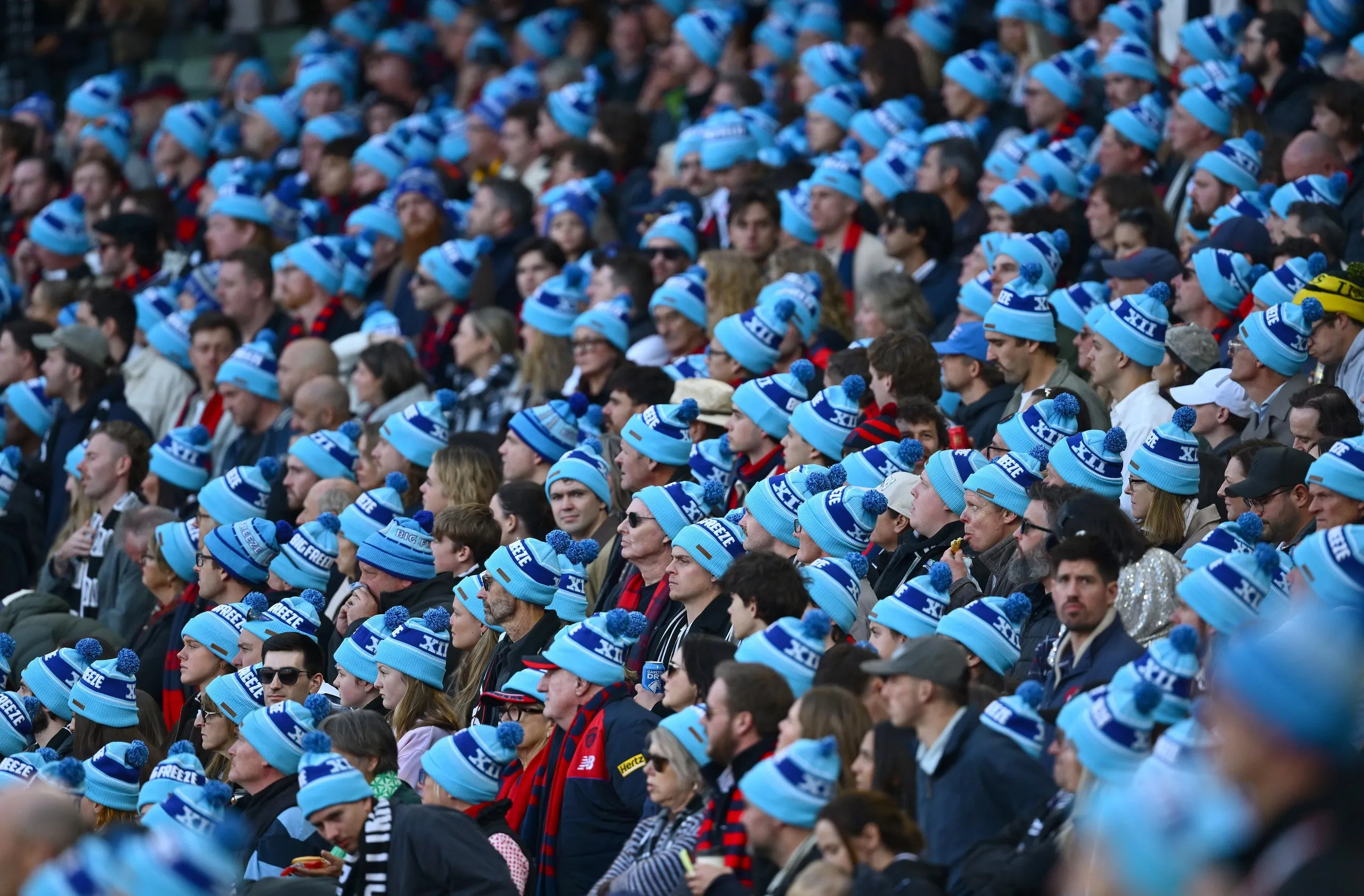 The crowd wears Big Freeze beanies for FightMND.
