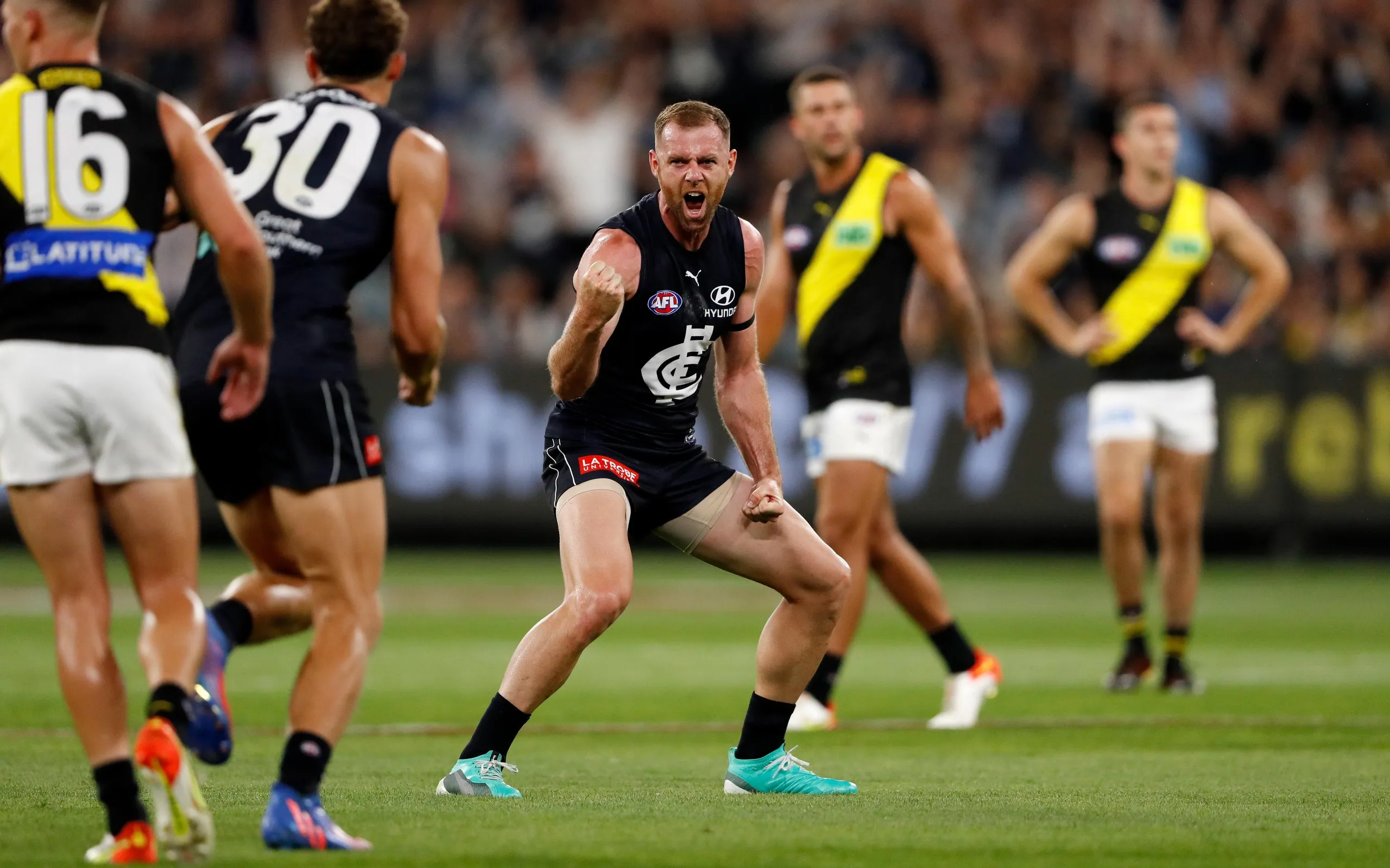 Sam Docherty celebrates kicking a goal for Carlton in his return from a first cycle of chemotherapy in 2022