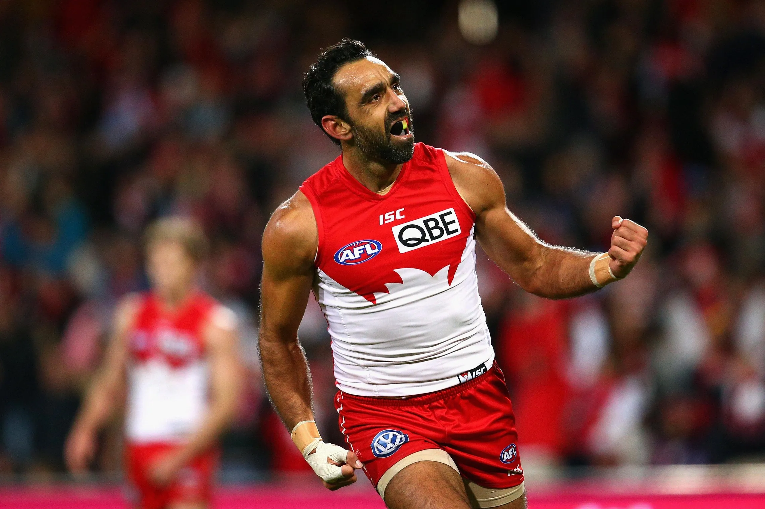 Adam Goodes of the Swans celebrates kicking a goal