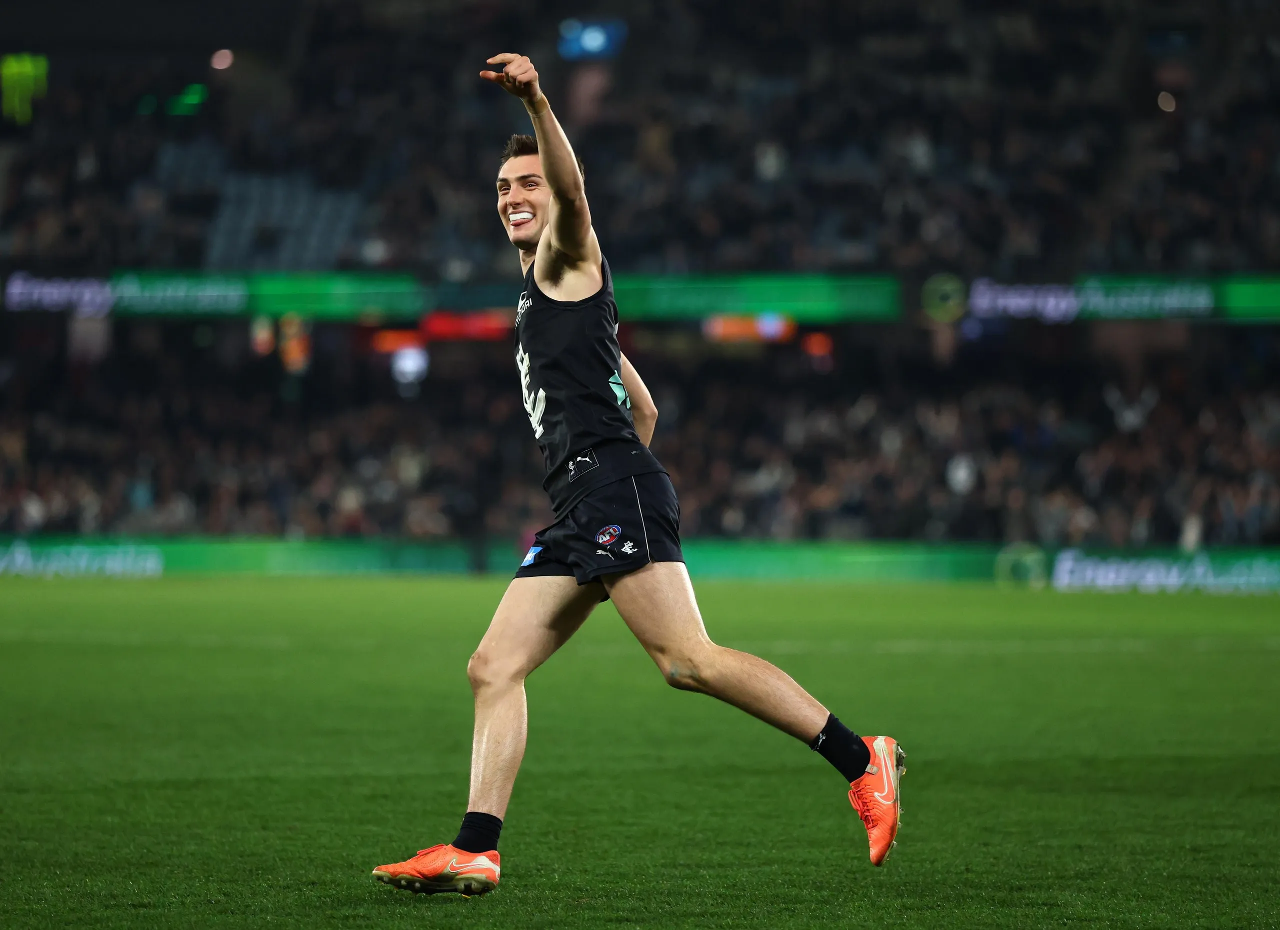 Jagga Smith celebrates kicking a goal against Brisbane at Marvel Stadium.