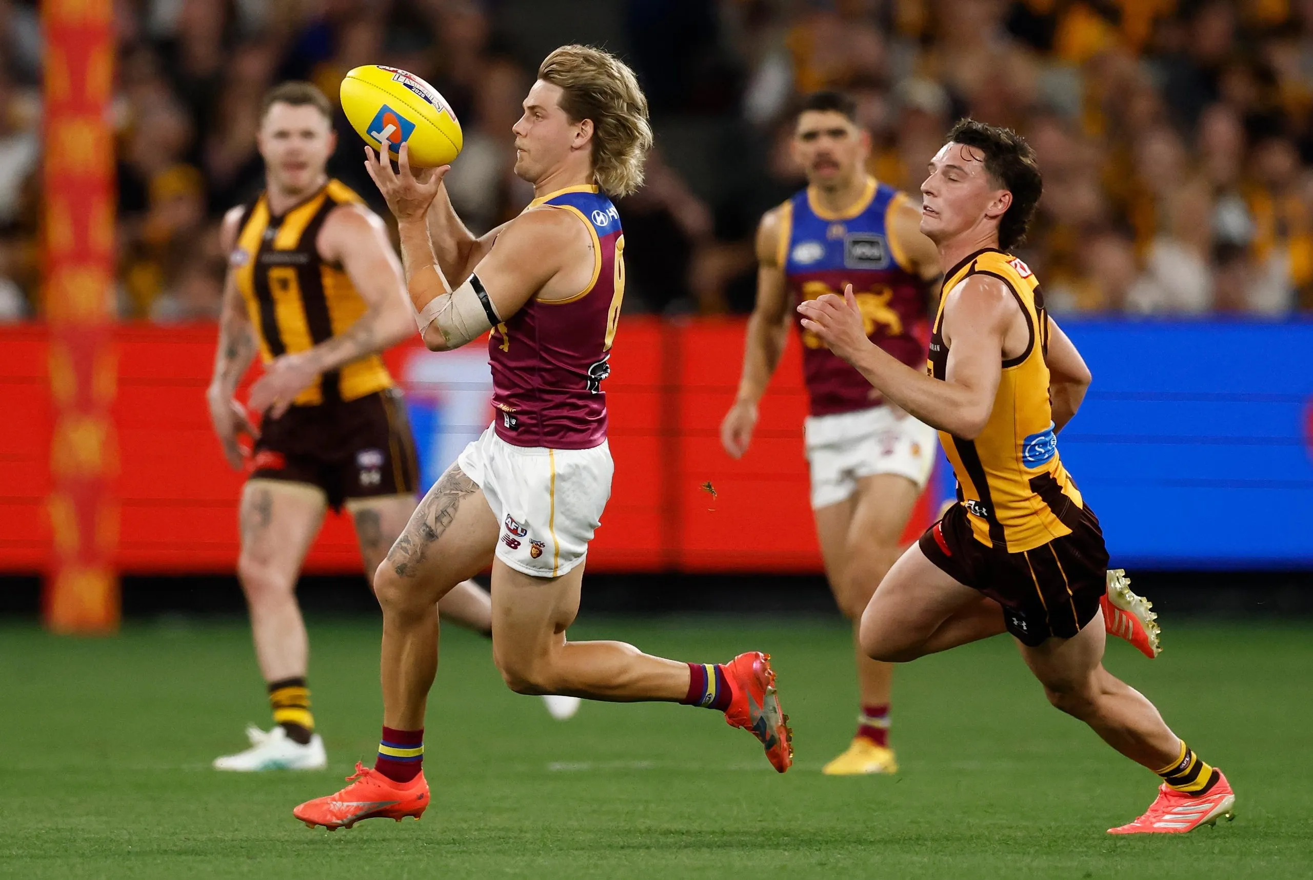 An oceanic calm: Will Ashcroft skips out of a centre clearance with the ball