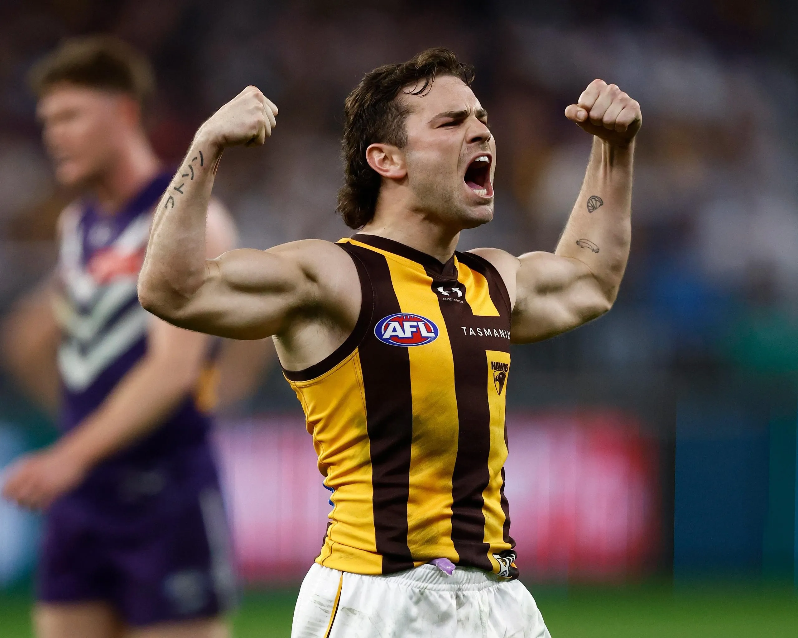 Nick Watson of the Hawks celebrates a goal