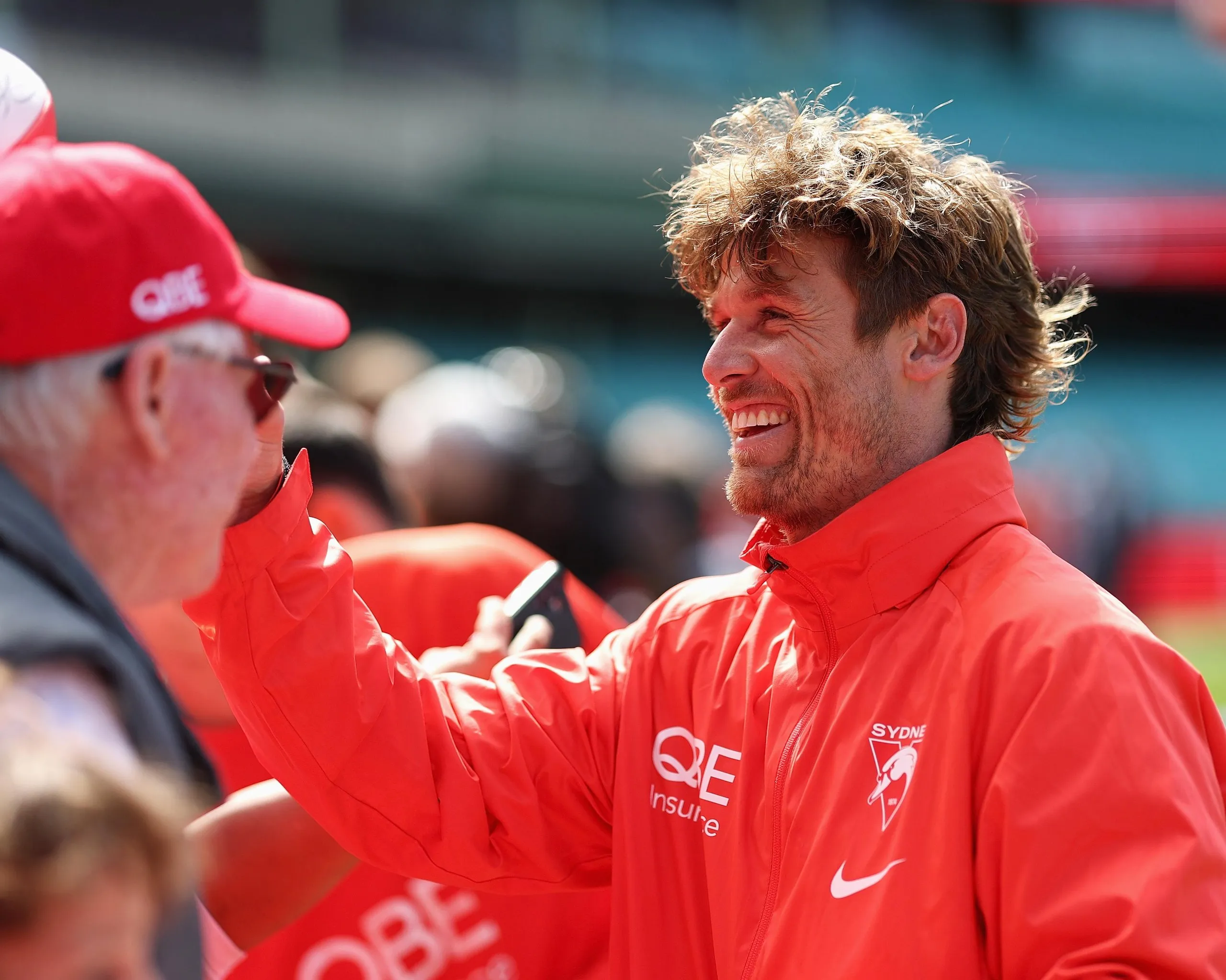 Sydney stand-in skipper Dane Rampe signs autographs during the Swans captain’s run at the SCG