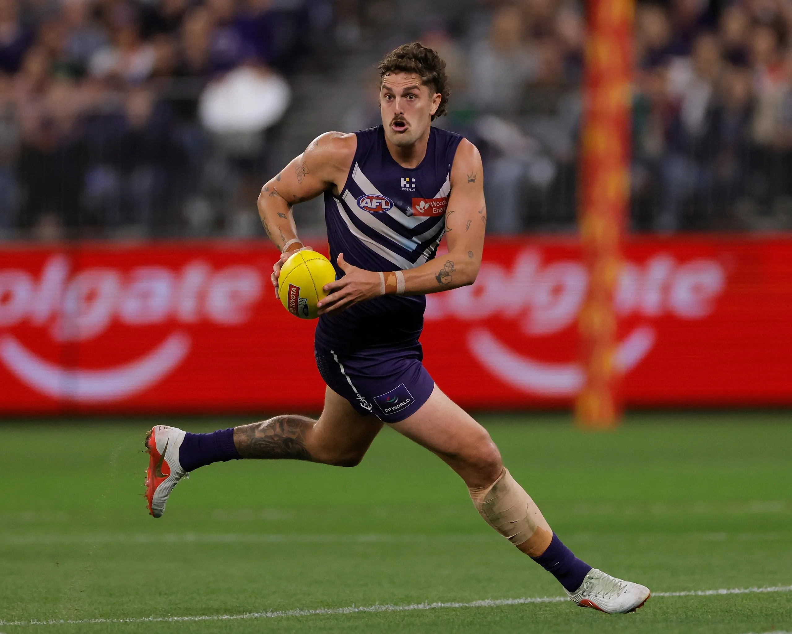 Luke Jackson of the Dockers runs the ball