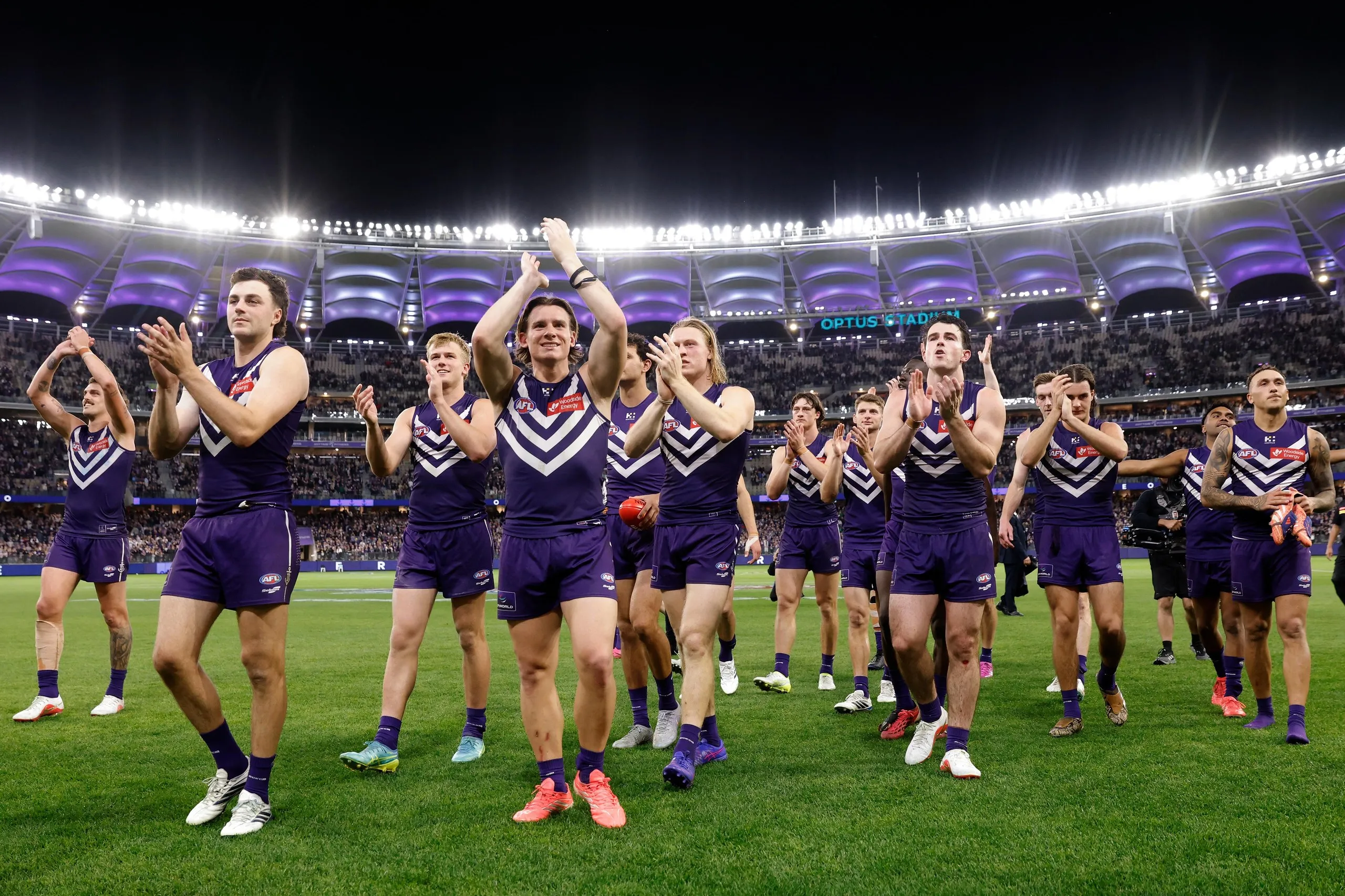 The Dockers leave the field after winning the AFL semi-final match against Geelong.